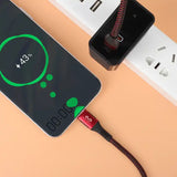 cable pd color rojo conectado a Android y cargador marca Miccell